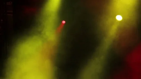 Artificial smoke clouds that reflect the colored lights on stage Stock Footage 72190693