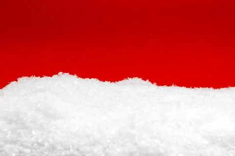 Artificial snow with red background Stock Photos
