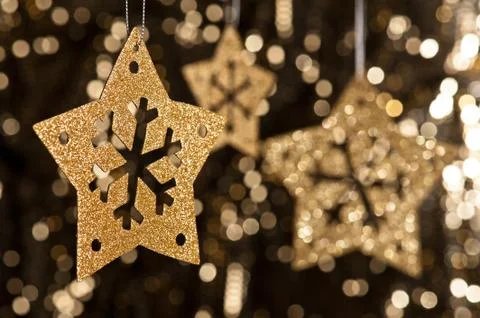 Artificial snowflake in gold Stock Photos