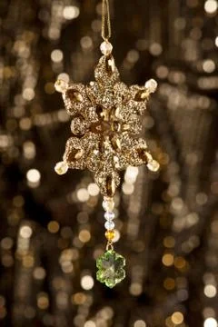 Artificial snowflake in gold Stock Photos
