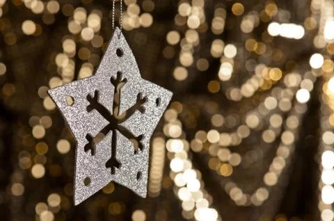 Artificial snowflake in silver Stock Photos