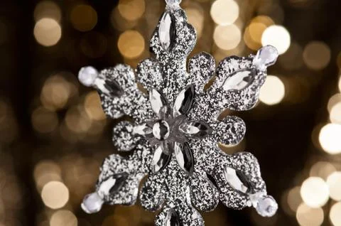 Artificial snowflake in silver Stock Photos