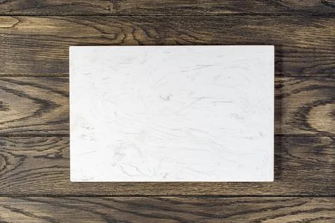 Artificial stone cutting board for kitchen on oak table Fotos de archivo