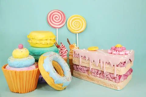Artificial sweets made from polystyrene foam, including colorful cupcakes Stock Photos
