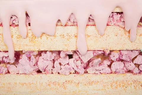 Artificial sweets made from polystyrene foam, layered with pink icing and Stockfoto's