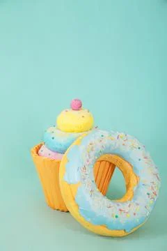 Artificial sweets made from polystyrene foam, featuring a colorful cupcake and a Stock Photos
