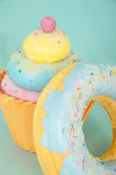Artificial sweets made from polystyrene foam, featuring a colorful cupcake and Stock Photos
