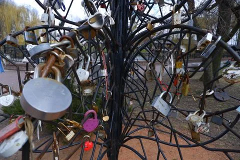 An artificial tree made of iron rods, hung with tourist door locks. Stock Photos