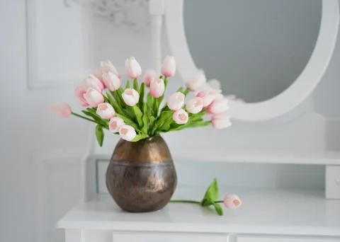 Artificial tulips on a table with a mirror Stock Photos