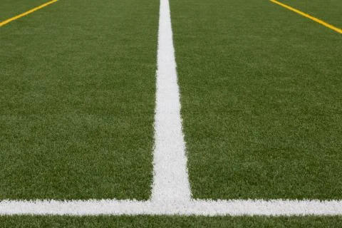 Artificial turf - 2 white and 2 yellow lines Stock Photos