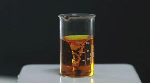 An artificial vortex in the beaker. Slow motion Video stock 68002620