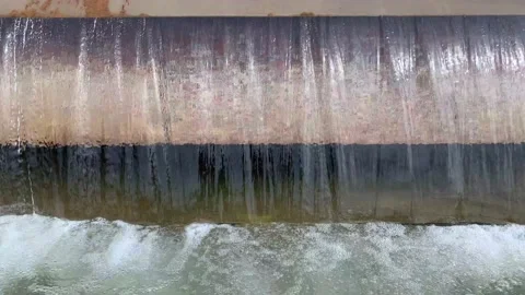 Artificial waterfall cascade of smoothly falling water in a continuous stream Stock Footage 133244289