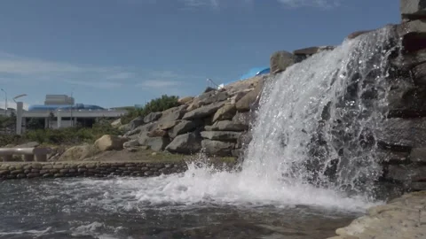 Artificial waterfall in the city park Stock Footage 162720958