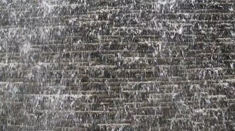 An artificial waterfall in the city square Stock Footage 50772980