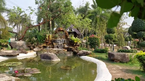 Artificial waterfall in the far corner Stock Footage 263511464