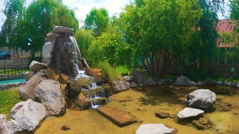 Artificial waterfall with fish Stock Footage 246427694