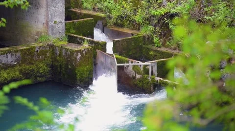 Artificial waterfall in forest mountain for production of electricity Vidéo 67633370