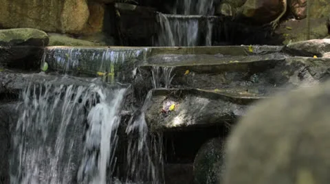 Artificial waterfall in the garden Stock Footage 26320678