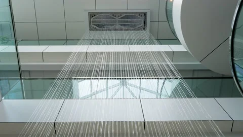 Artificial waterfall jets flows down from ceiling or decorative fountain in Stock-Footage 147955700