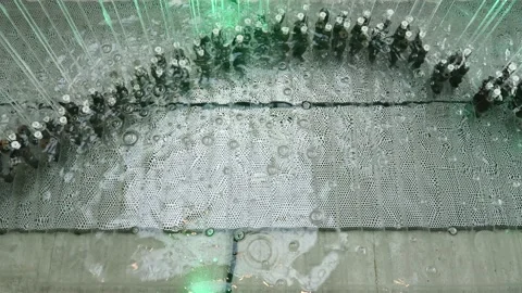 Artificial waterfall jets flows down from ceiling or decorative fountain in Stock-Footage 147957883