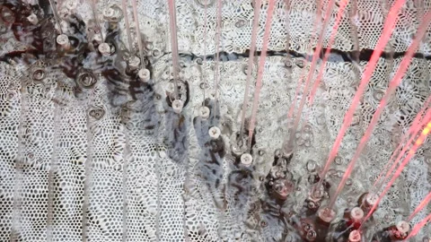 Artificial waterfall jets flows down from ceiling or decorative fountain in Stock-Footage 147958145