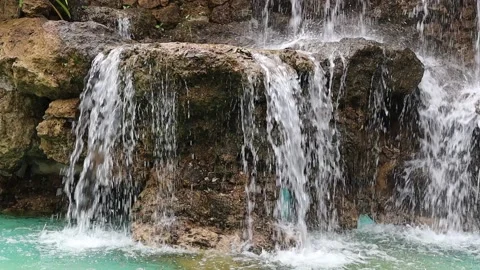Artificial waterfall made from stones arranged as a stair step down Stock Footage 141306705