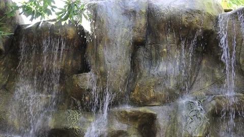 Artificial waterfall made from stones arranged as a stair step down Video stock 141306994