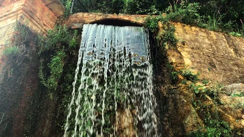 Artificial waterfall of a mountain river Stock Footage 128906823