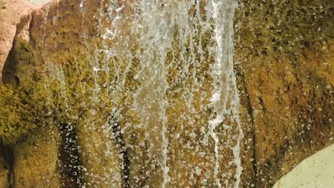 Artificial waterfall in a natural park. Artificial waterfall against the Stock Footage 318722053