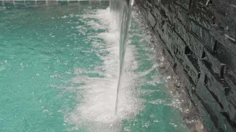 Artificial waterfall in pool, side view Stock-Footage 308730103