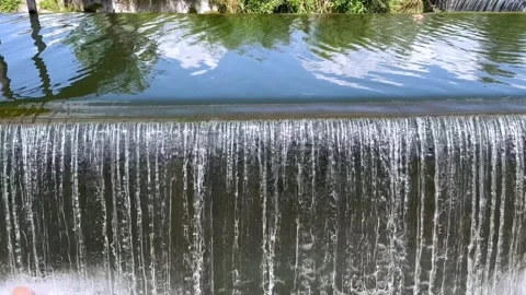 Artificial waterfall on the river Stock Footage 246773289