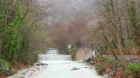 Artificial waterfall on the river  Termopotamos. 4К Stock Footage 61552167