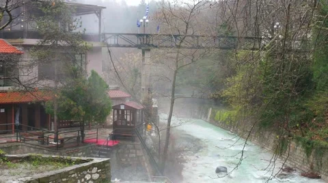 Artificial waterfall on the river  Termopotamos. 4К 스톡 동영상 61552330