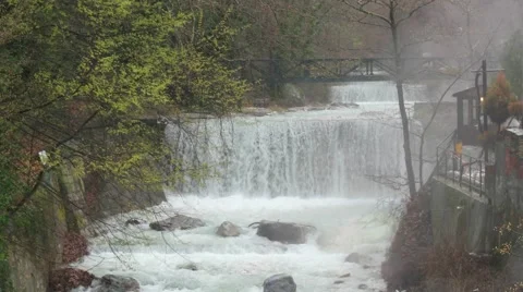 Artificial waterfall on the river  Termopotamos. 4K Stock Footage 61775946
