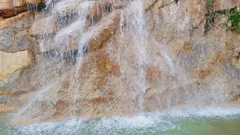 Artificial waterfall, water falls in jets down Stock Footage 163898779