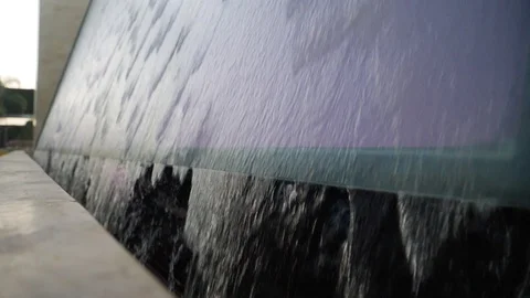 Artificial waterfall water on night wall with colorful lighting Stockbeeldmateriaal 108374632