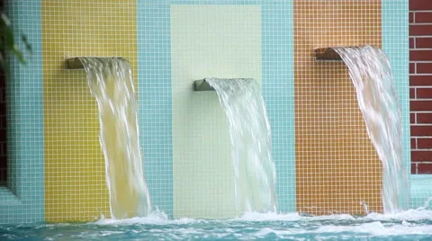 Artificial waterfalls in indoor pool Stock Footage 62314519