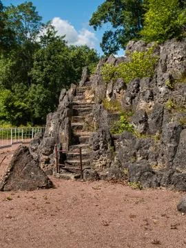 Artificially created composition in the form of a rock overgrown with vegetat Stock Photos