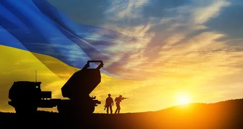 Artillery rocket system are aimed to the sky and soldiers at sunset with Stock Photos
