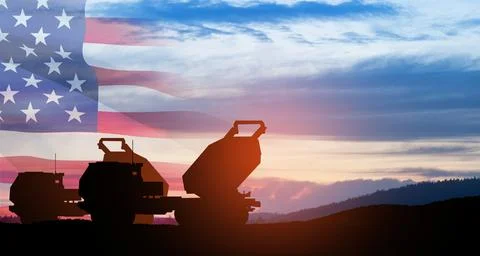 Artillery rocket system are aimed to the sky at sunset with USA flag. Multi.. Stock Photos