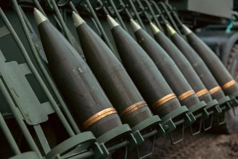 Artillery shell 155 mm on combat vehicle platform. artillery shell on a com.. Stock Photos