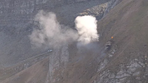 Artillery shell explodes against the target fired by Alpine troops in mountains 動画素材 223359725