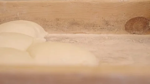 An Artisan Baker Skillfully Preparing Dough to Create Fresh, Warm Bread Video stock 295167766