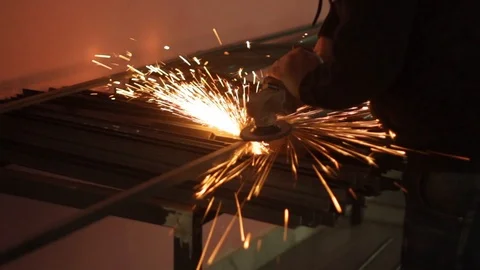 Artisan blacksmith with grinder making sparks 3/4 Stock Footage 86524183