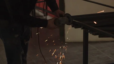 Artisan blacksmith with grinder making sparks 4/4 Stock Footage 86524317