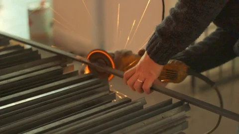 Artisan blacksmith with grinder making sparks 1/4 Stock Footage 86525843