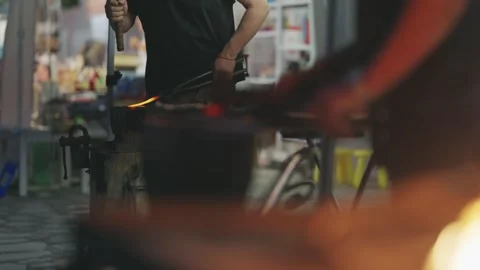Artisan Blacksmith Hammering Red-Hot Iron, Showcasing Ancient Craft Stock Footage 339751488