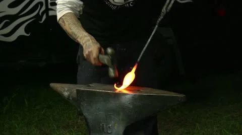 Artisan blacksmith shaping a part of a sculpture. Stock Footage 12660149