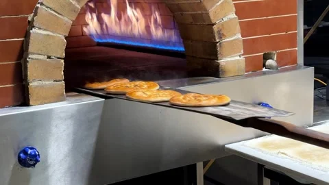 Artisan Bread Baking in Brick Oven – 4K Video. Stock-Footage 304320271