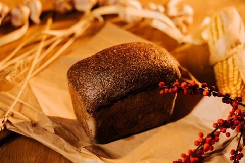 Artisan bread displayed on rustic table with decorative elements 写真素材